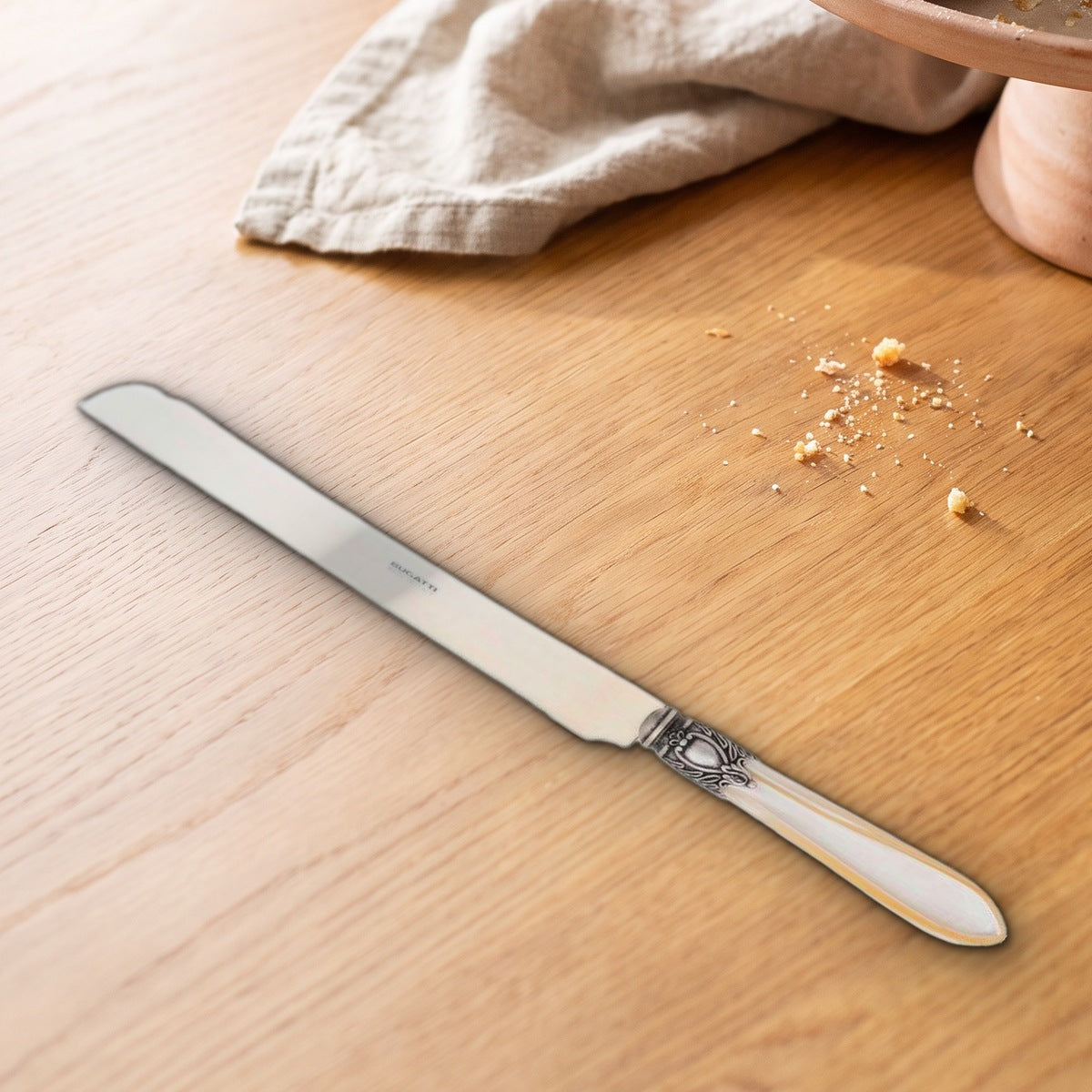 Casa Bugatti Oxford Antique cake knife on a warm oak table