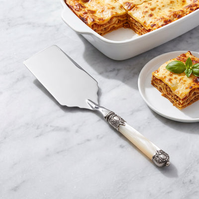 Square pie and lasagne server with a lasagna dish on grey marble