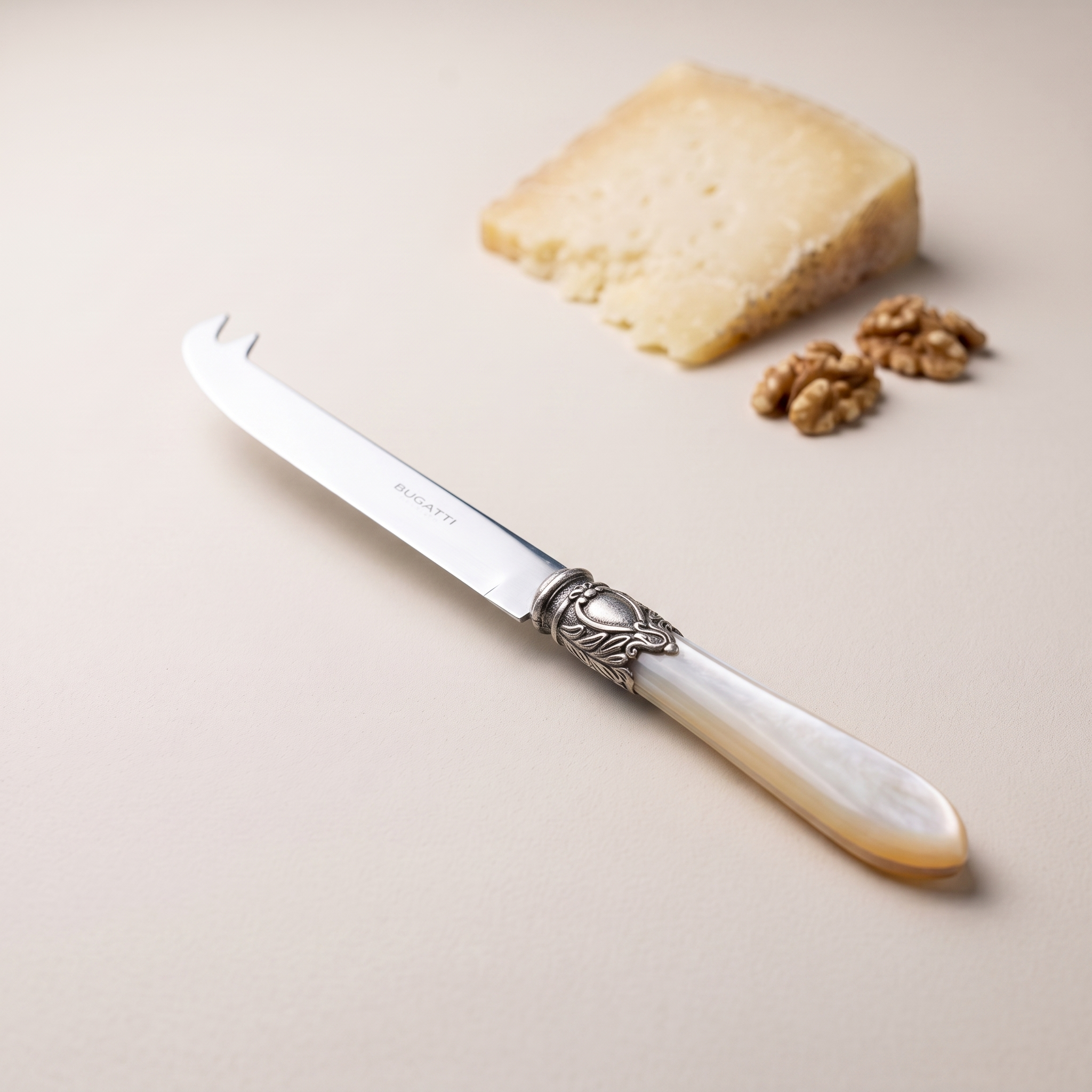 Oxford Antique two-point deer cheese knife in ivory, with aged pecorino and walnuts