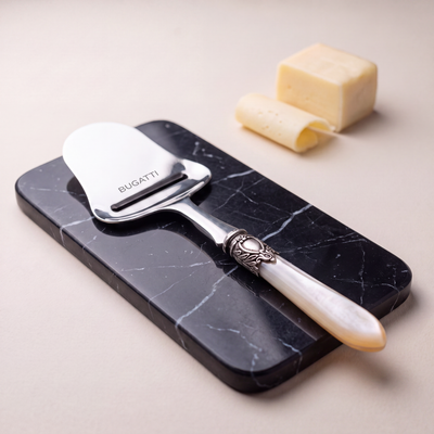 Cheese Slicers on black Marquina marble — Casa Bugatti