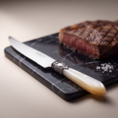 Steak Knives on black Marquina marble — Casa Bugatti