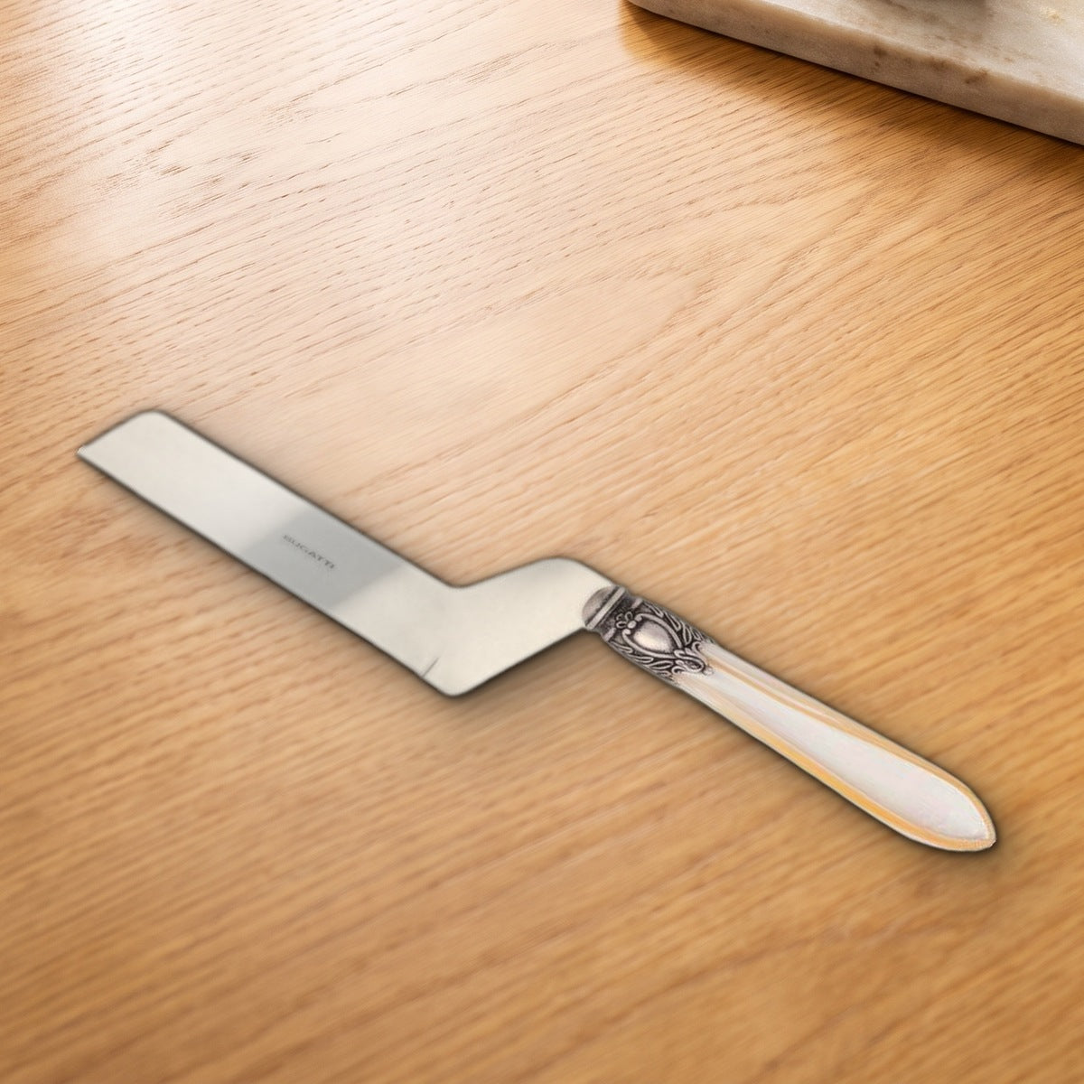 Casa Bugatti Oxford Antique cheese knife on a warm oak table