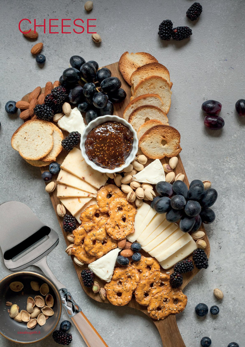 Cheese knives on a board, catalogue page
