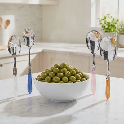 Serving spoons around a bowl that changes to each spoon's dish