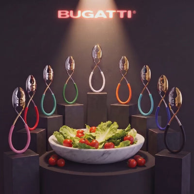 Kiss salad tongs gallery with the BUGATTI neon sign flickering on the back wall