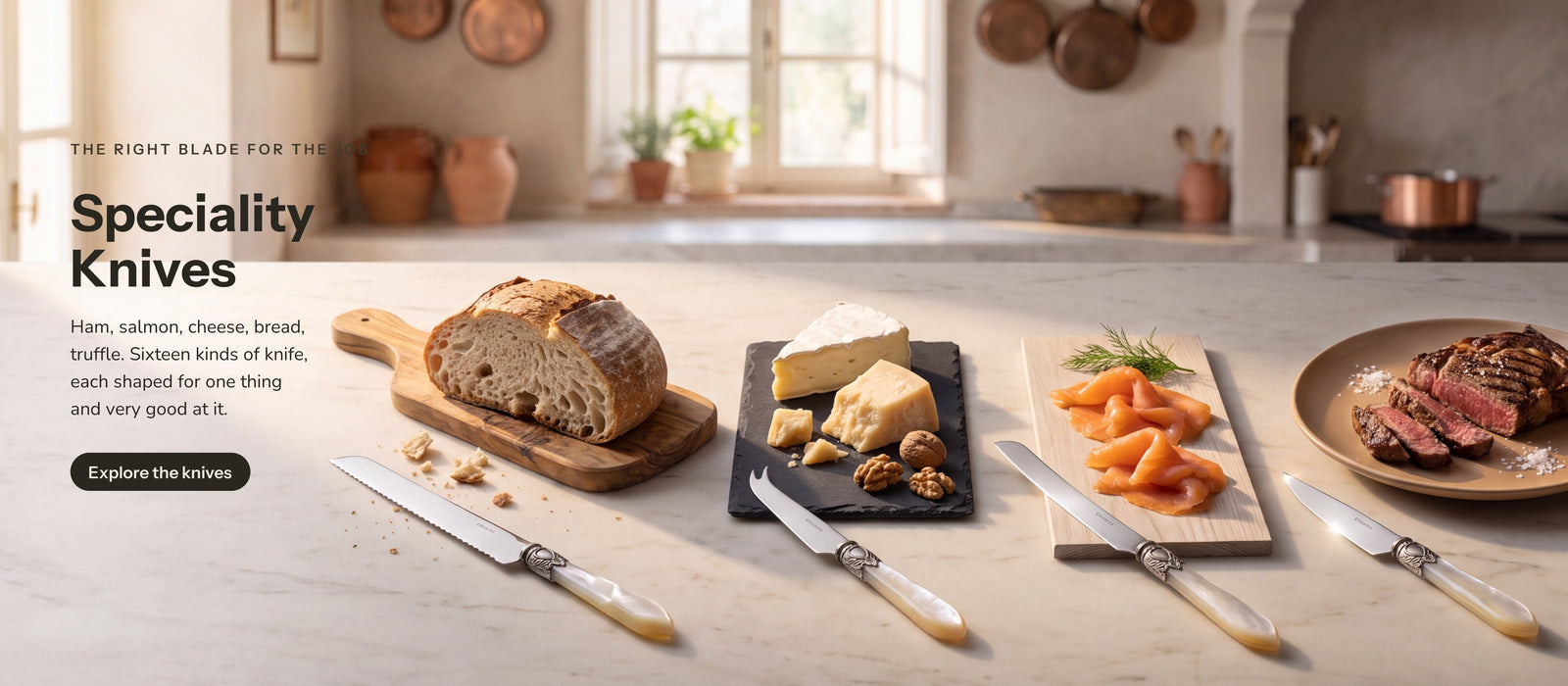Casa Bugatti speciality knives in an Italian kitchen — bread, cheese, salmon and steak knives on a marble counter. Speciality Knives: the right blade for the job. Ham, salmon, cheese, bread, truffle. Sixteen kinds of knife, each shaped for one thing and very good at it.